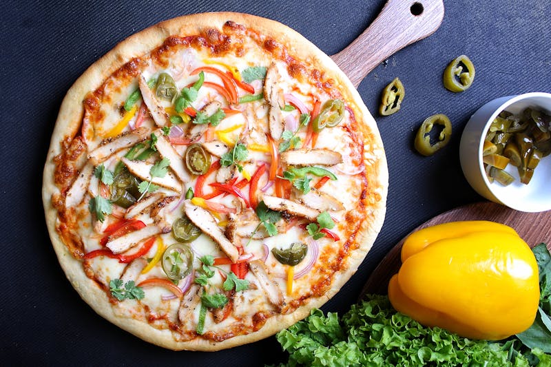 Veggie supreme pizza with colorful toppings